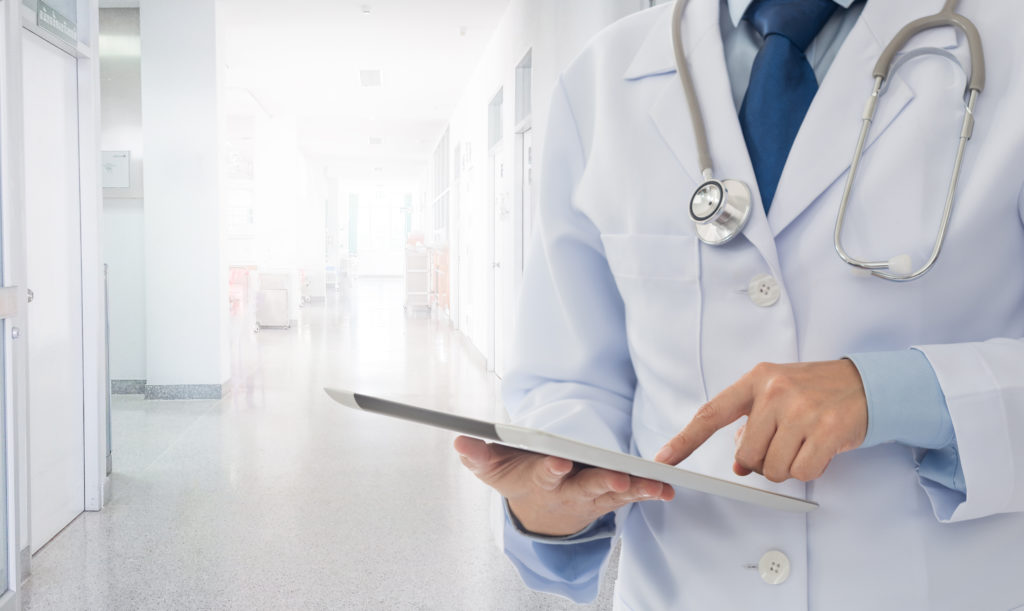 Doctor working with technology